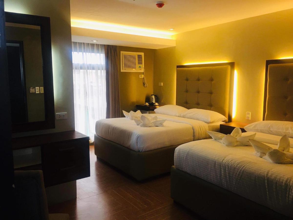 เทรชเชอร์ ไอส์แลนด์ โฮเต็ล วิธ มินิวอเตอร์ แอดเวนเจอร์ Hotel Masbate City ภายนอก รูปภาพ