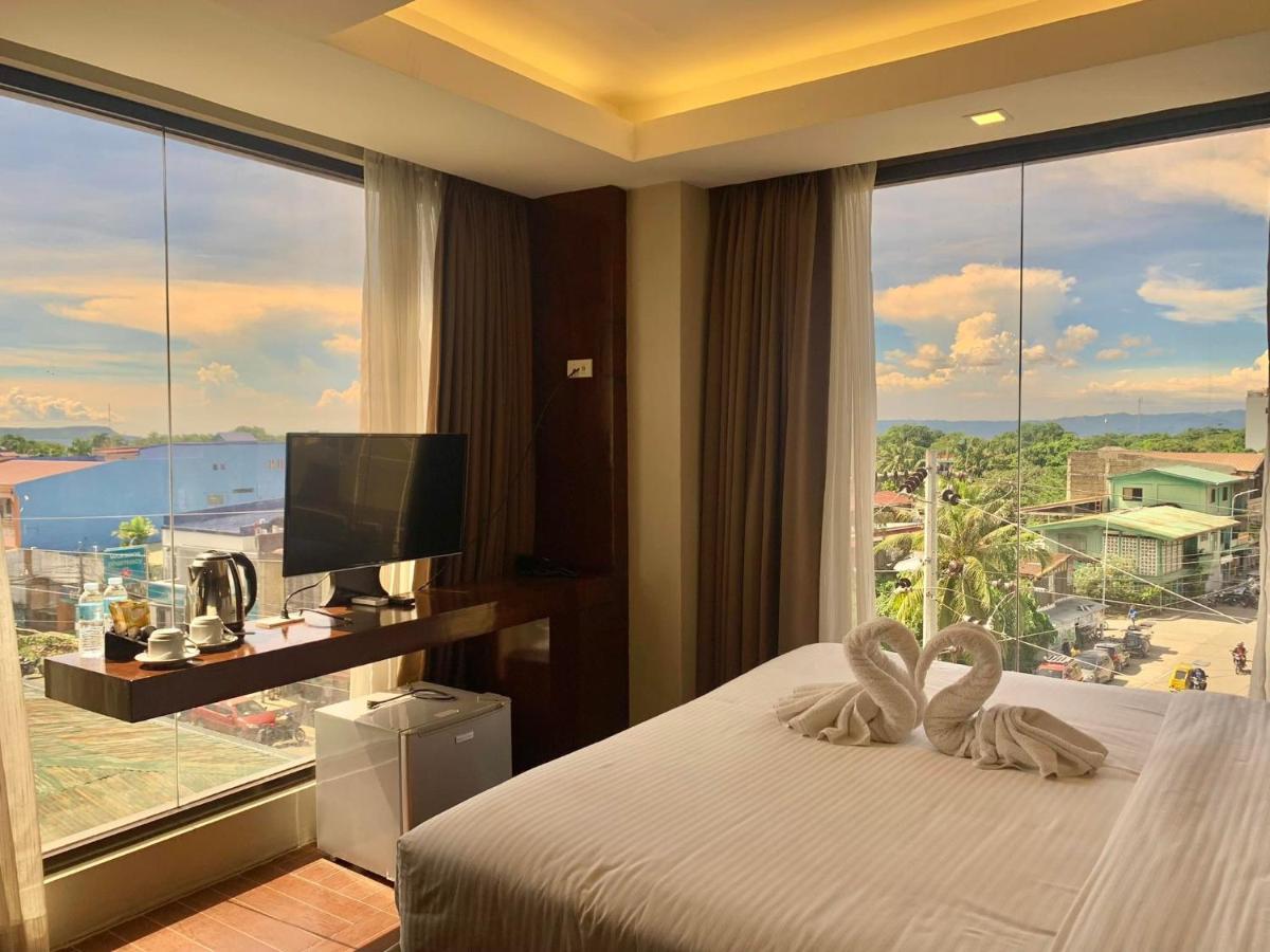 เทรชเชอร์ ไอส์แลนด์ โฮเต็ล วิธ มินิวอเตอร์ แอดเวนเจอร์ Hotel Masbate City ภายนอก รูปภาพ