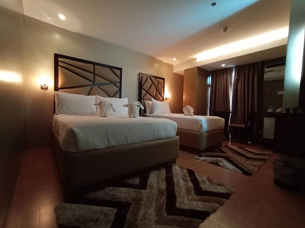 เทรชเชอร์ ไอส์แลนด์ โฮเต็ล วิธ มินิวอเตอร์ แอดเวนเจอร์ Hotel Masbate City ภายนอก รูปภาพ