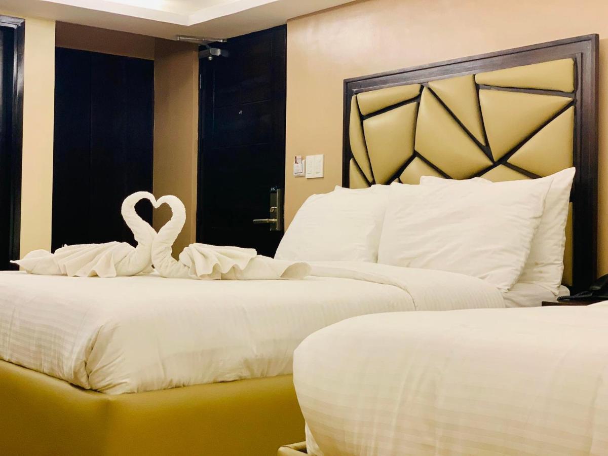 เทรชเชอร์ ไอส์แลนด์ โฮเต็ล วิธ มินิวอเตอร์ แอดเวนเจอร์ Hotel Masbate City ภายนอก รูปภาพ